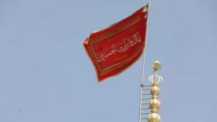 waa-maxay-sababta-calanka-cas-looga-taagay-masjidka-jamkaran-ee-magaalada-qom?